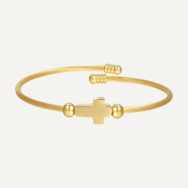 Gedrehte Armspange mit Kreuz