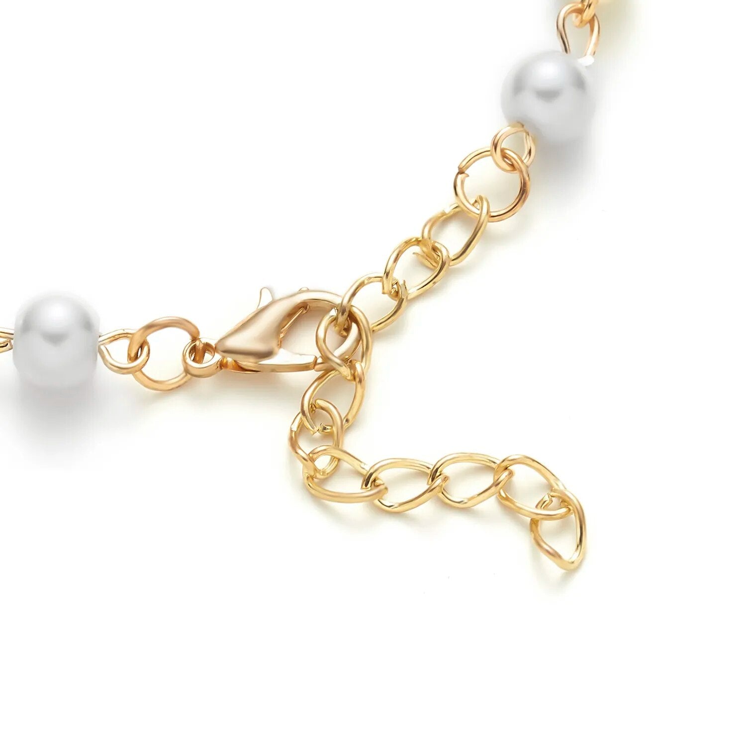 Armband mit Perlmuttperlen und Kreuzanhänger